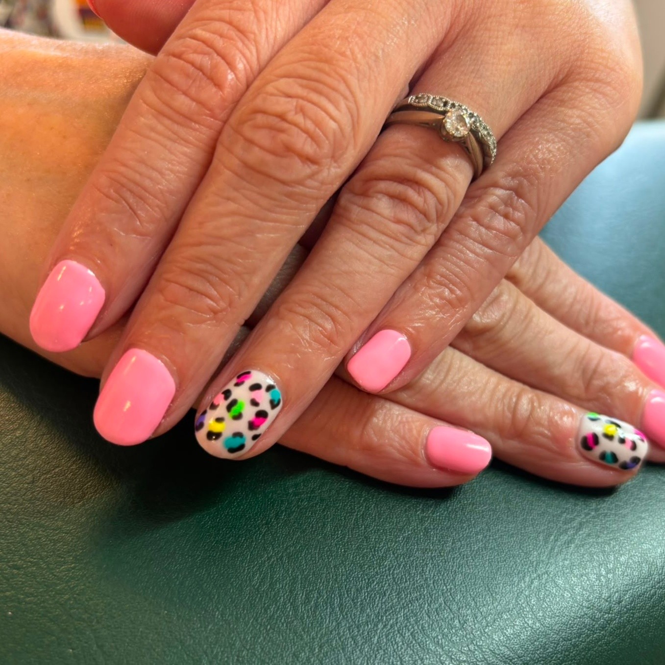 Pink gel nails with leopard print accent nails